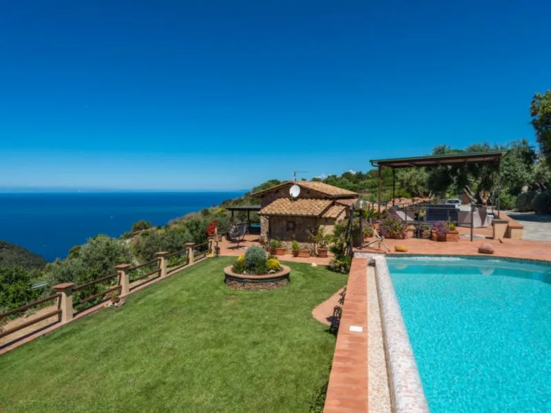 Tuscan stone villa with private pool, terraced lawn and sweeping Tyrrhenian Sea views