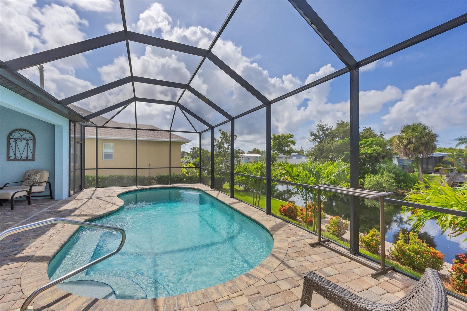 Gorgeous, large lanai with sparkling pool overlooking the canal. Lanai also features a dining table for 6 and 32-inch Smart TV. Pool size: 22' x 8' x 6'D
