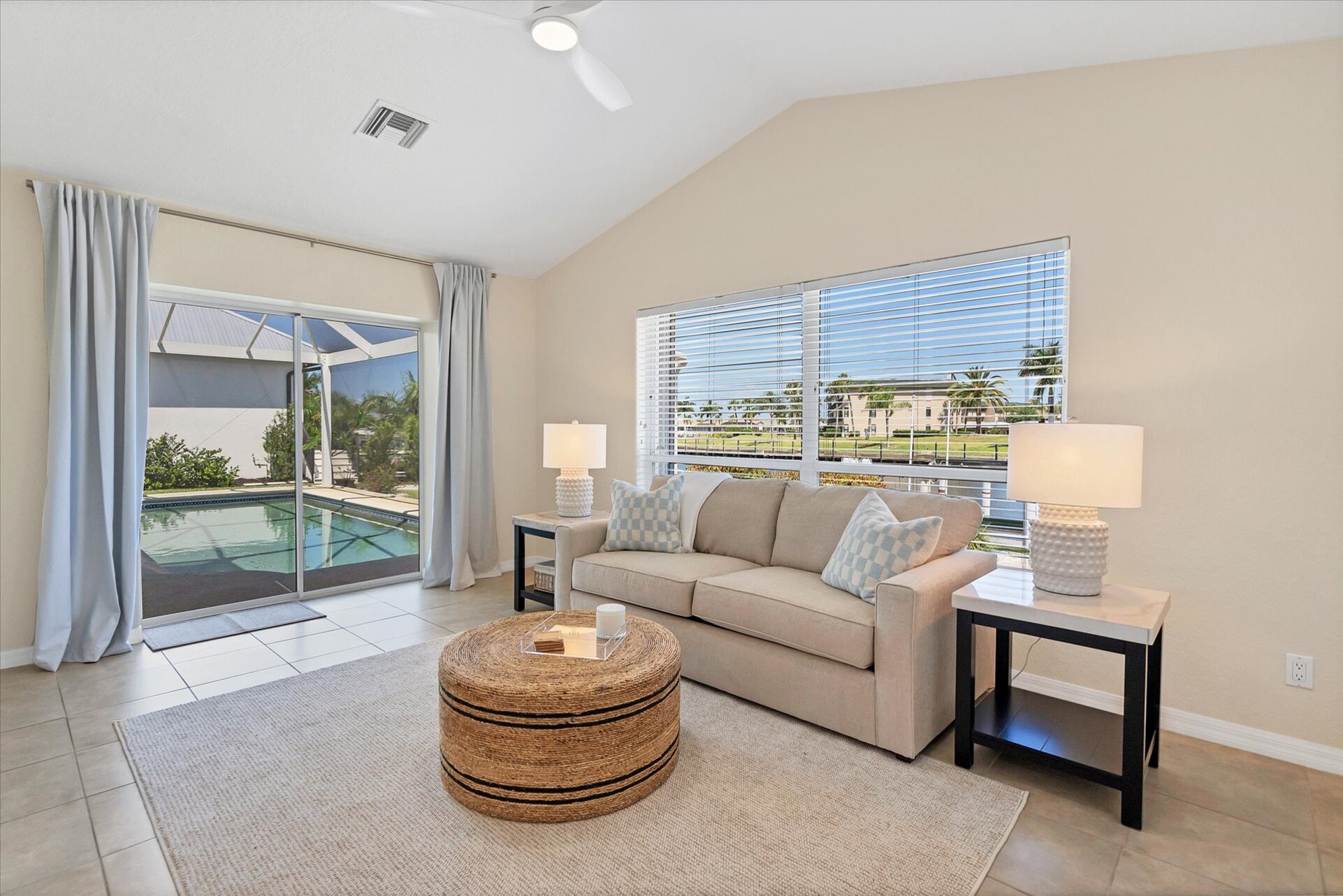 Wet bar & additonal sleeping space overlooks the canal & features a wet bar, lanai access and a queen sleeper sofa