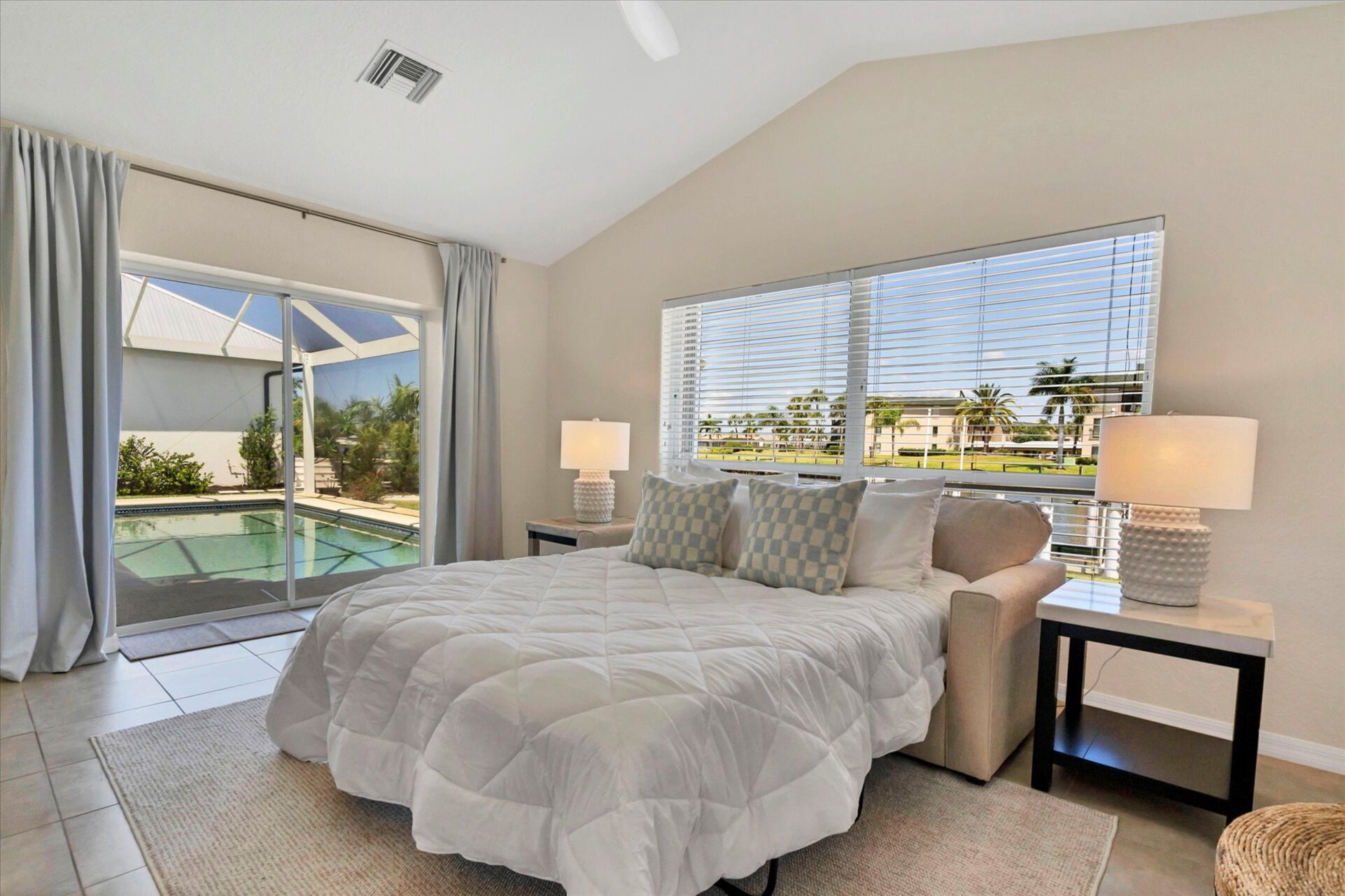 Wet bar & additonal sleeping space overlooks the canal & features a wet bar, lanai access and a queen sleeper sofa