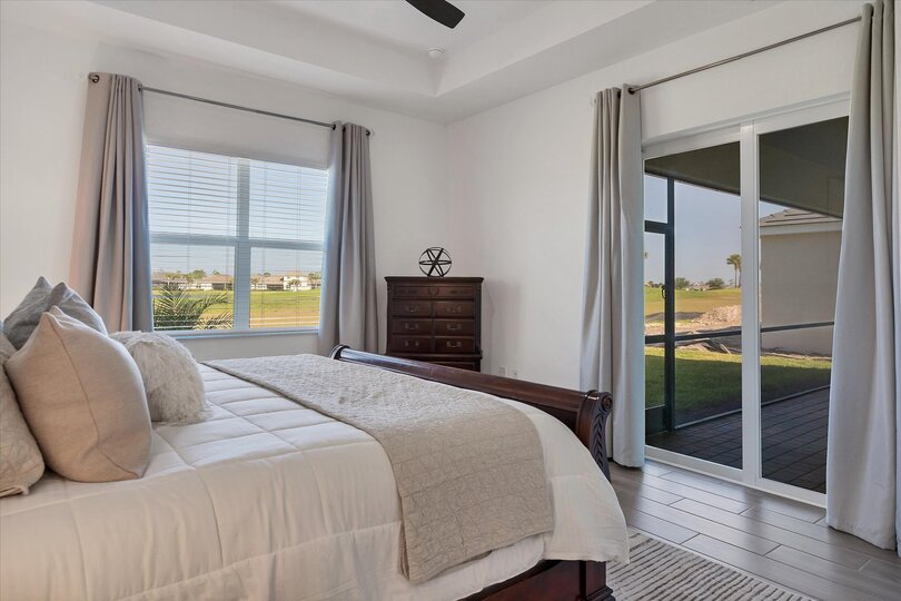 Primary bedroom with king bed, lanai access and ensuite