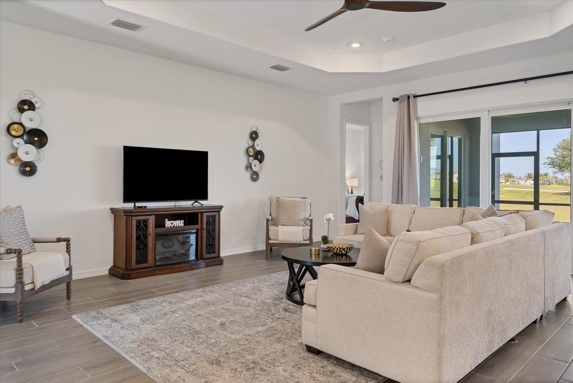 Beautiful, bright, open living space. Living room features large, comfy, sectional sofa and 60" Smart TV