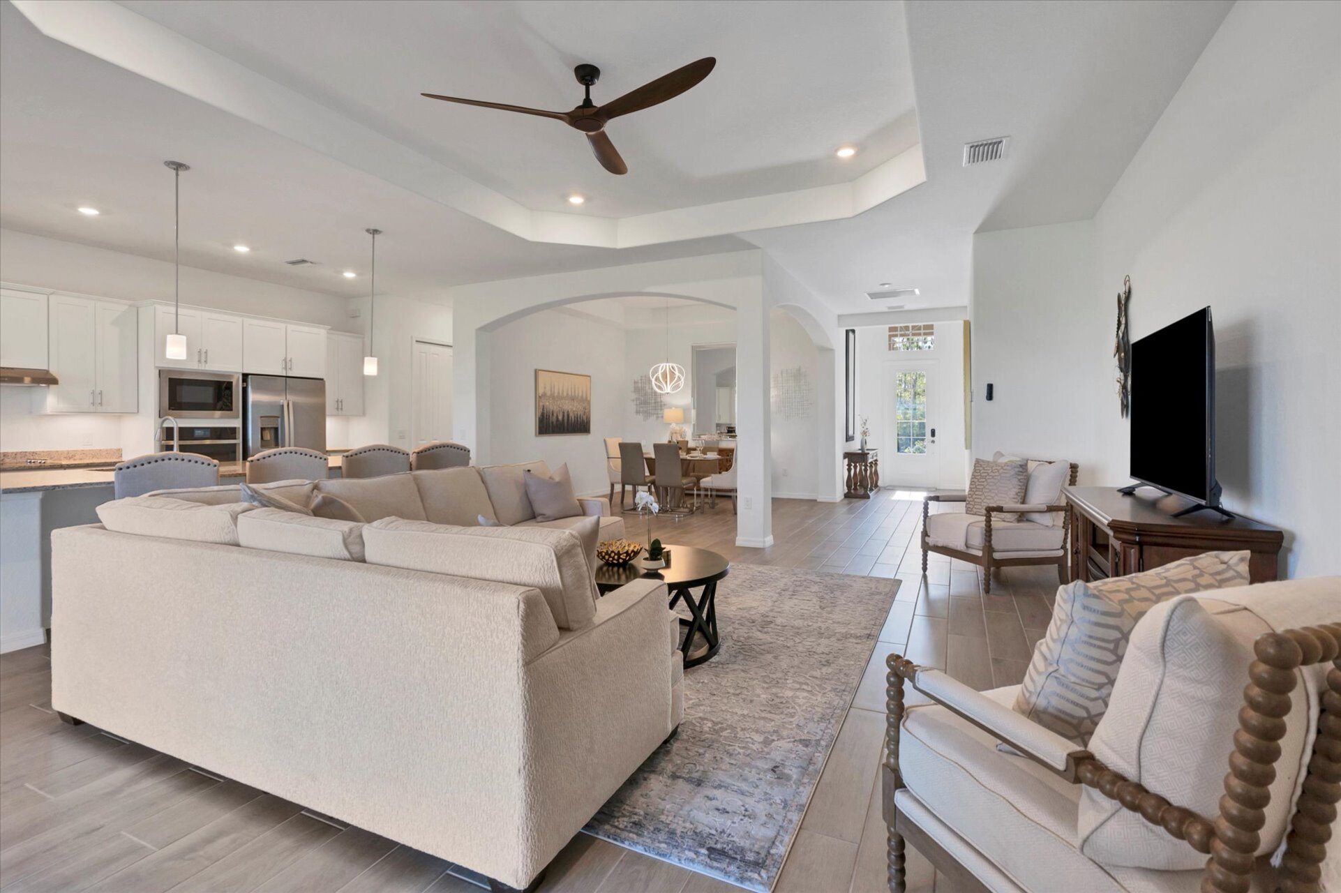 Beautiful, bright, open living space. Living room features large, comfy, sectional sofa and 60" Smart TV