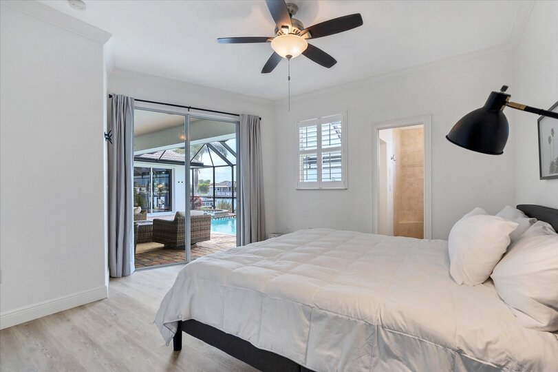 Guest Bedroom has a king bed and patio access