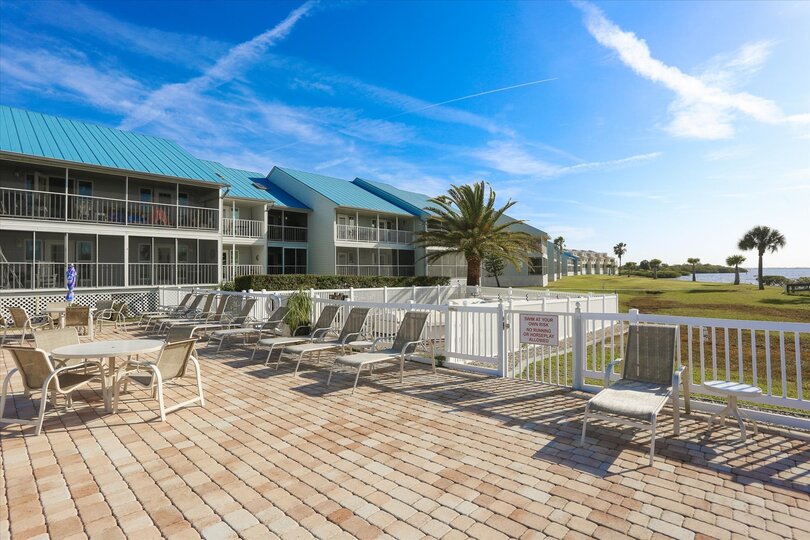 Community pool with plenty of lounge seating