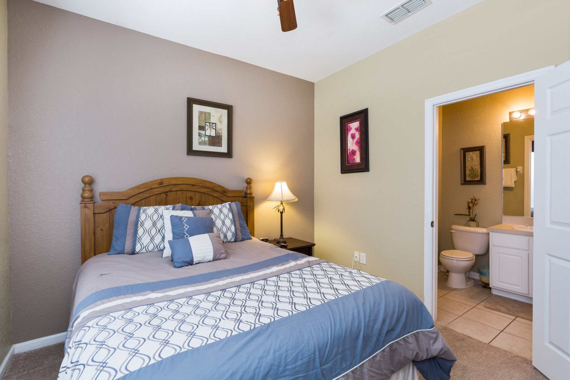 The second bedroom is located on the first floor with a queen bed and ensuite bathroom