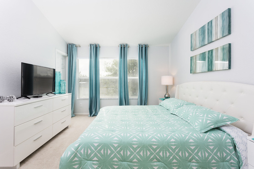 The second floor master bedroom is perfect for relaxing on vacation