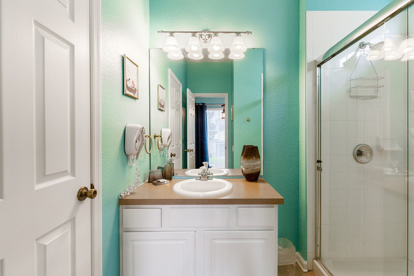 The en-suite bathroom for queen bedroom with glass walk-in shower