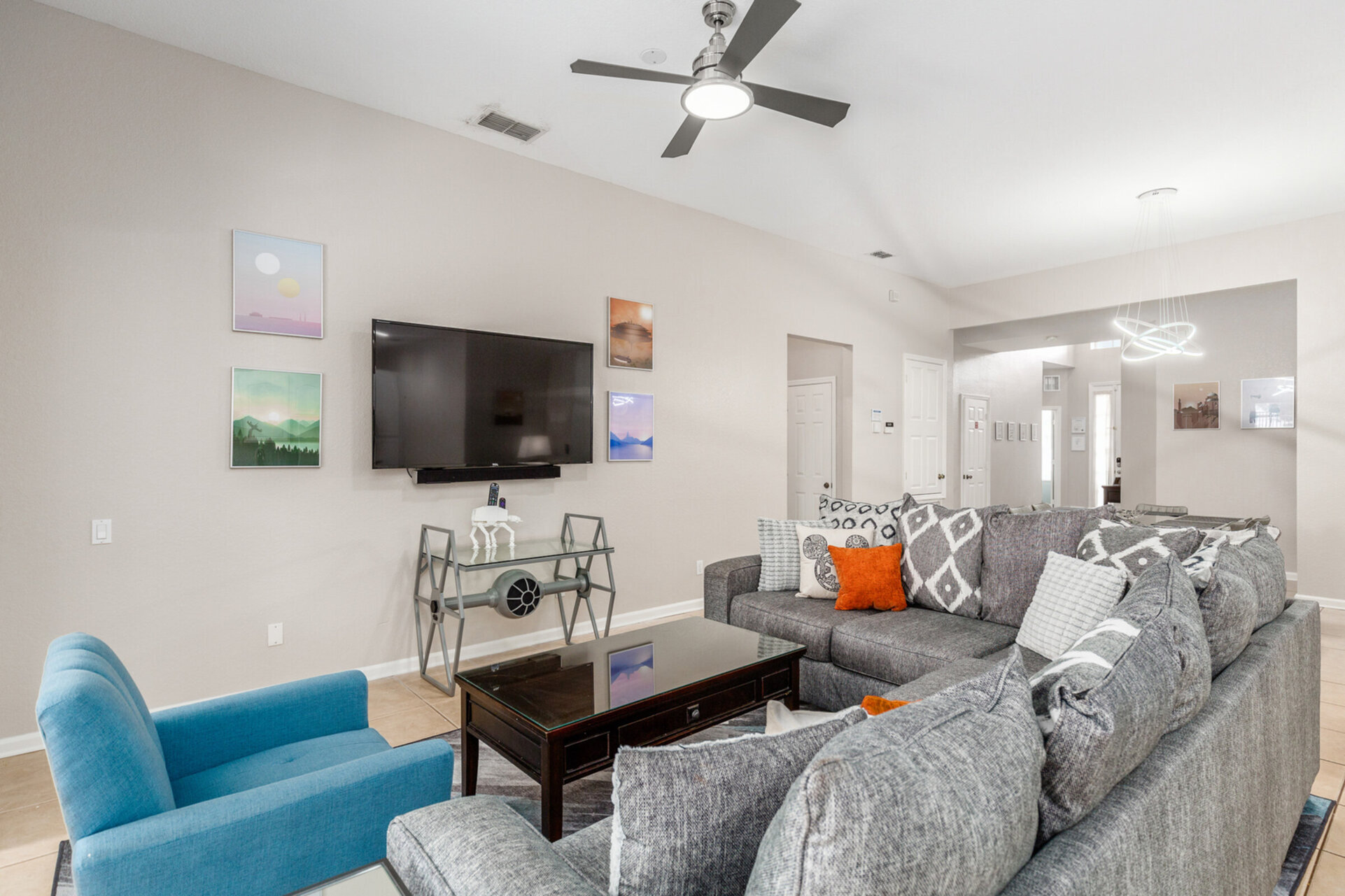 The living area features a 65-inch 4K SMART TV