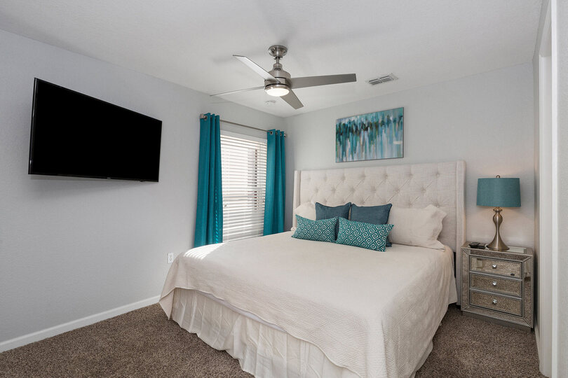 The third master suite located on the second floor features king size bed and 50-inch SMART TV