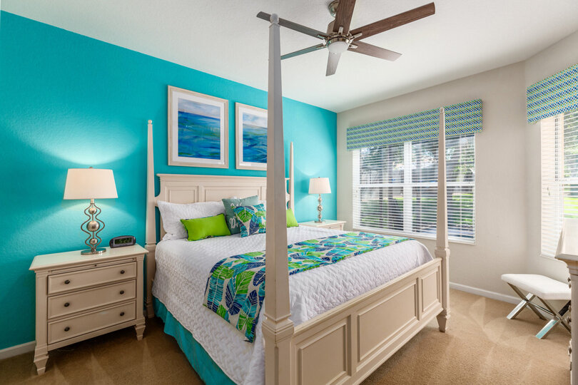 A ground floor Master Suite furnished with a king-size bed