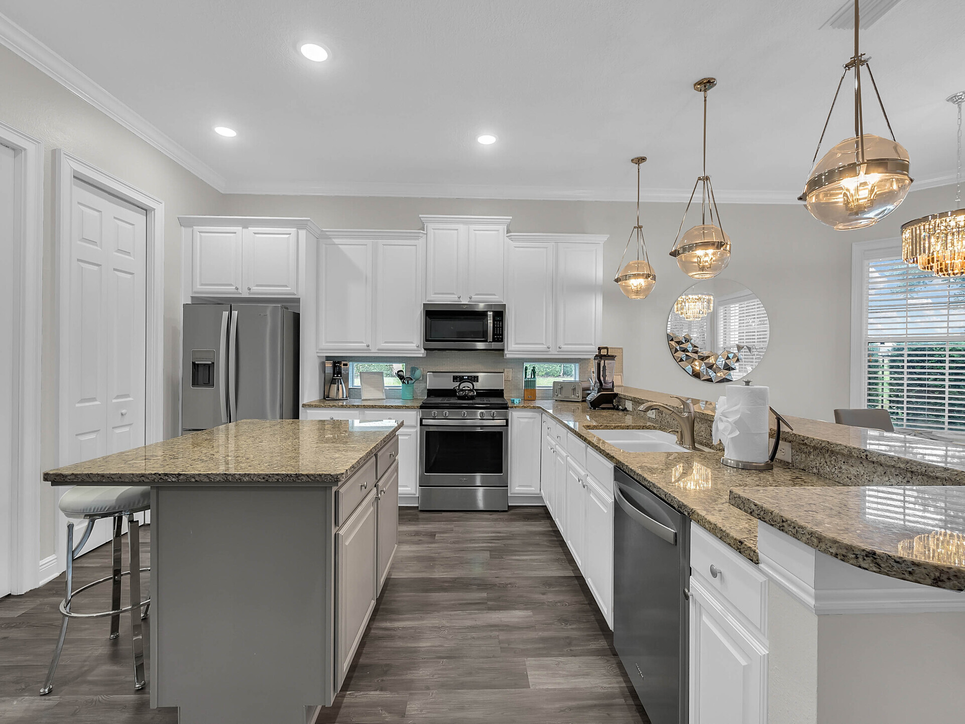 Large fully equipped kitchen with stainless steel appliances