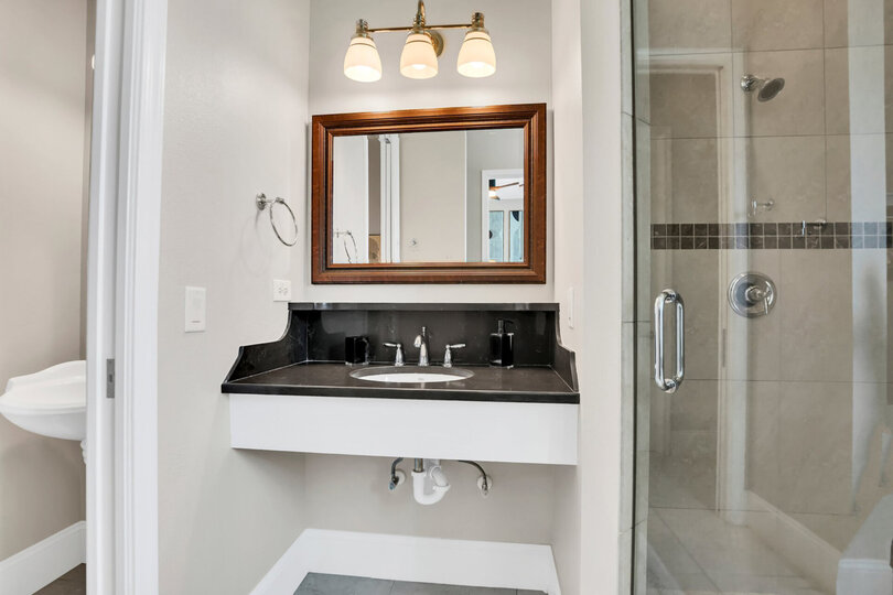 The en-suite includes a walk in shower and garden tub