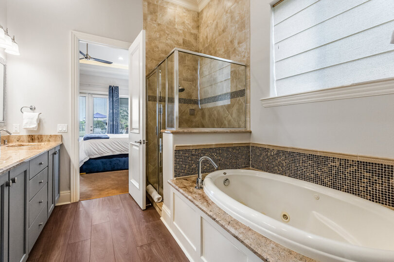 This bedroom comes with a private bathtub.