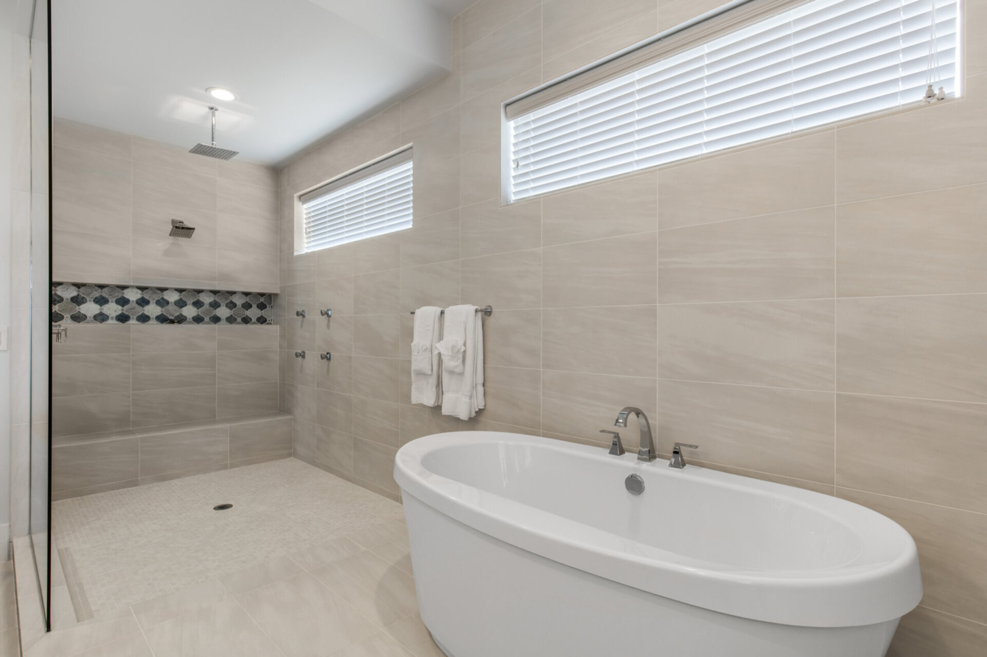 Take a shower under the rainfall showerhead or soak in your large bathtub