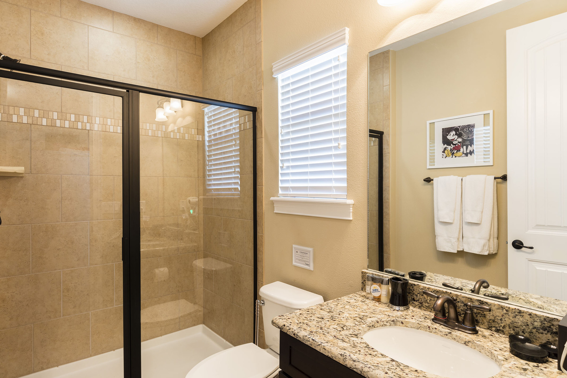 The kids private bathroom has a walk-in shower