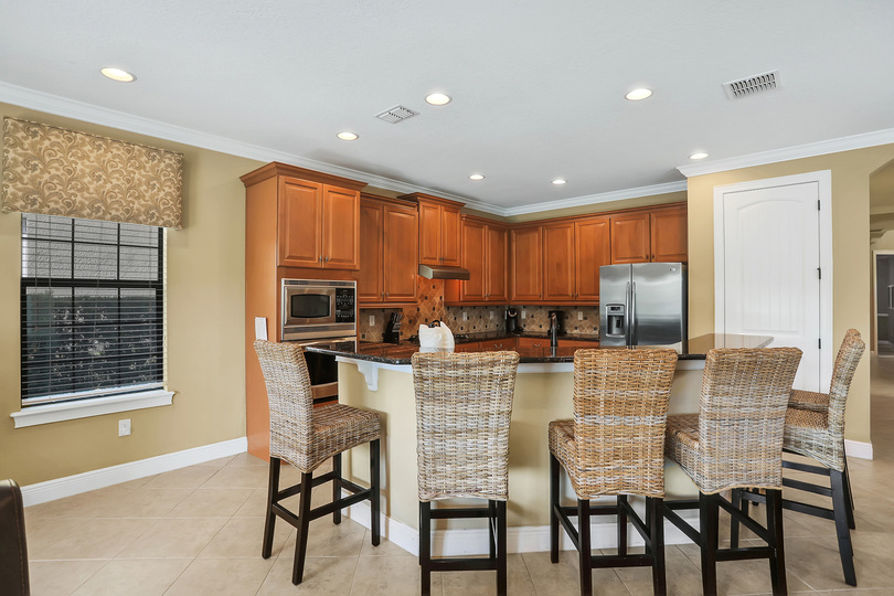 In addition to the dining table there is seating for 6 at the breakfast bar