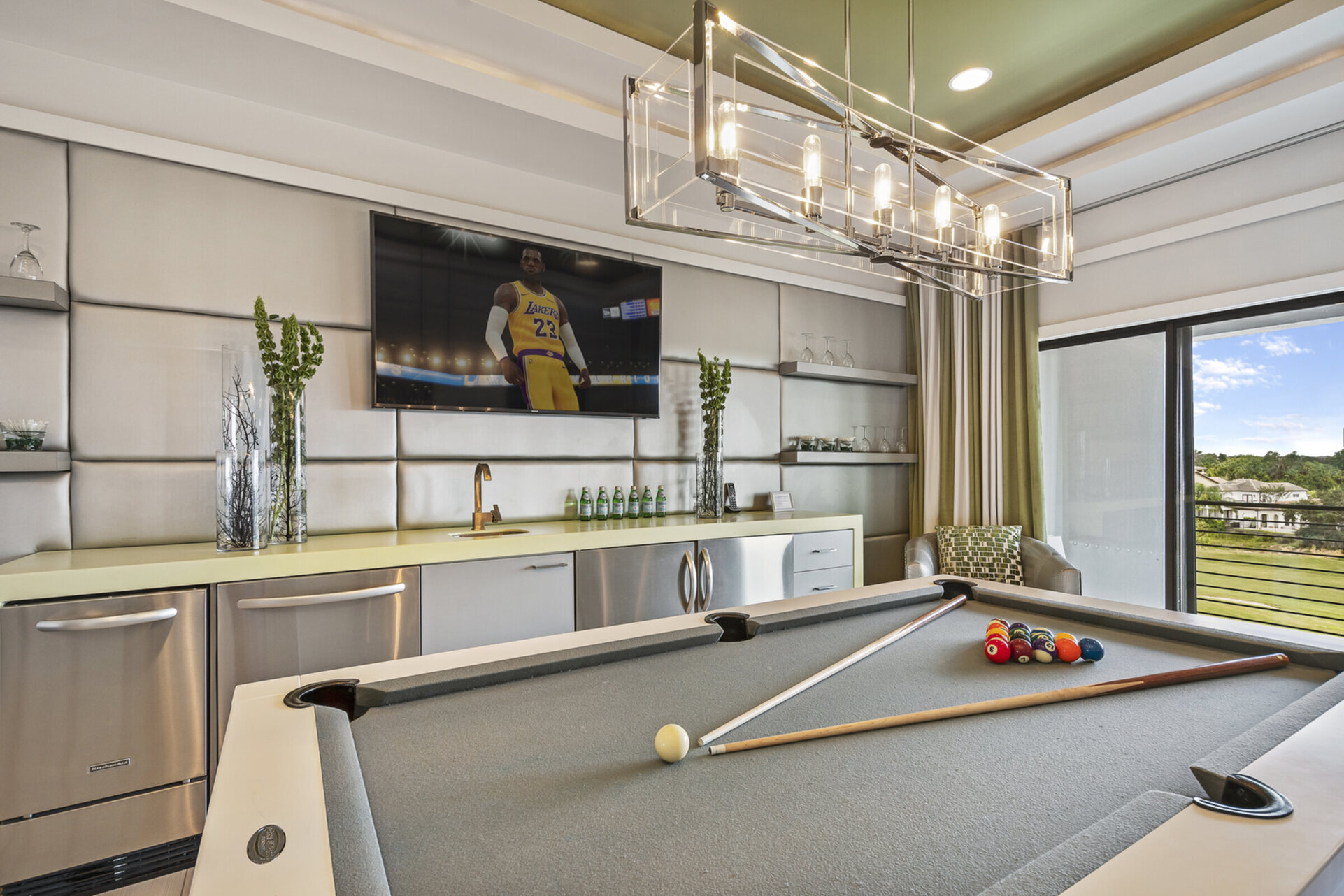 A convenient wet bar in the loft games area