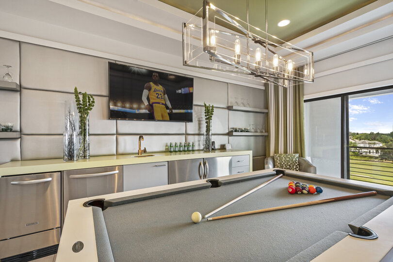 A convenient wet bar in the loft games area