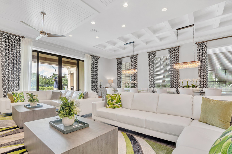Spacious and comfortable living area with a beautiful view to the pool area