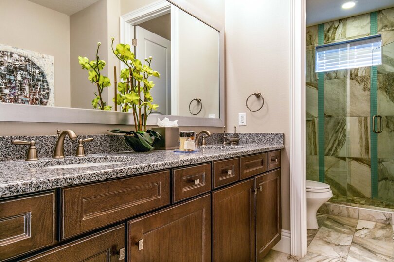 En-suite bathroom with dual vanity and walk-in shower