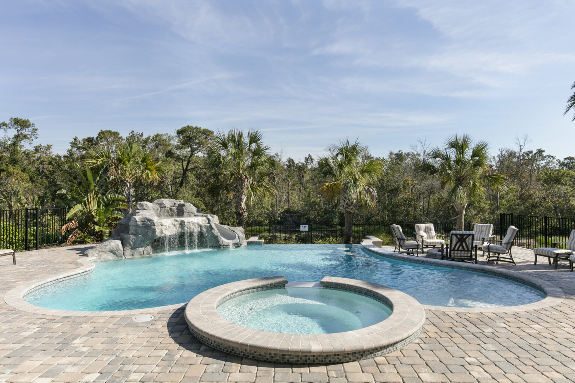 The pool also features a grotto sitting are
Disclaimer: Pool slide is currently out of order.