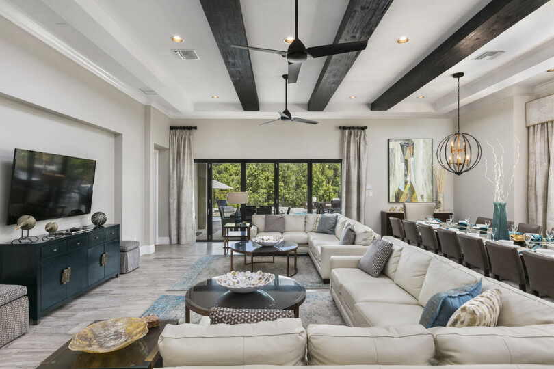 Sit back and relax in the living room with ample seating and 70-inch SMART TV