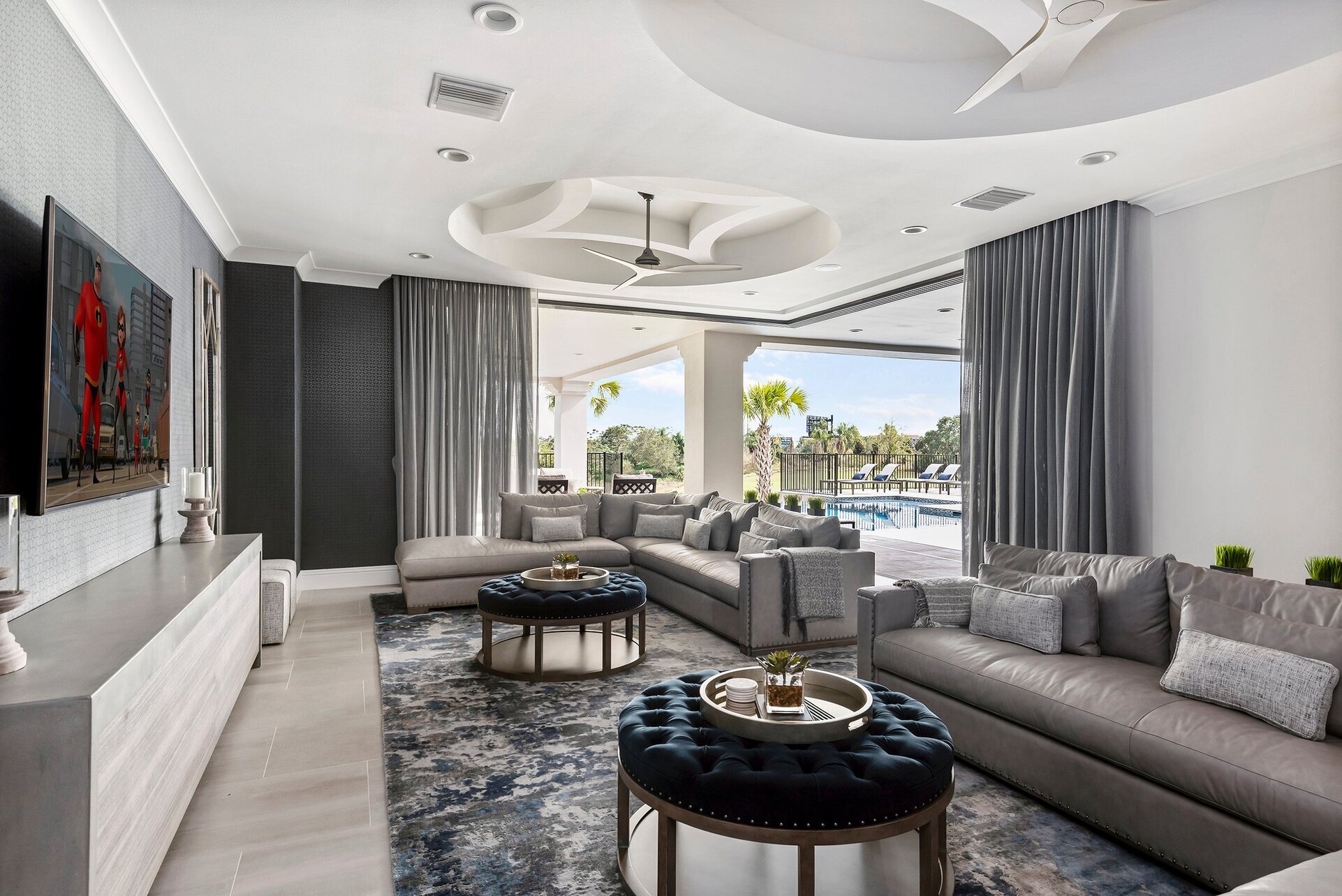 Watch a show on the 74 inch HD 4K SMART TV while relaxing on luxurious leather sectional sofas
DISCLAIMER: the patio doors cannot remain open.