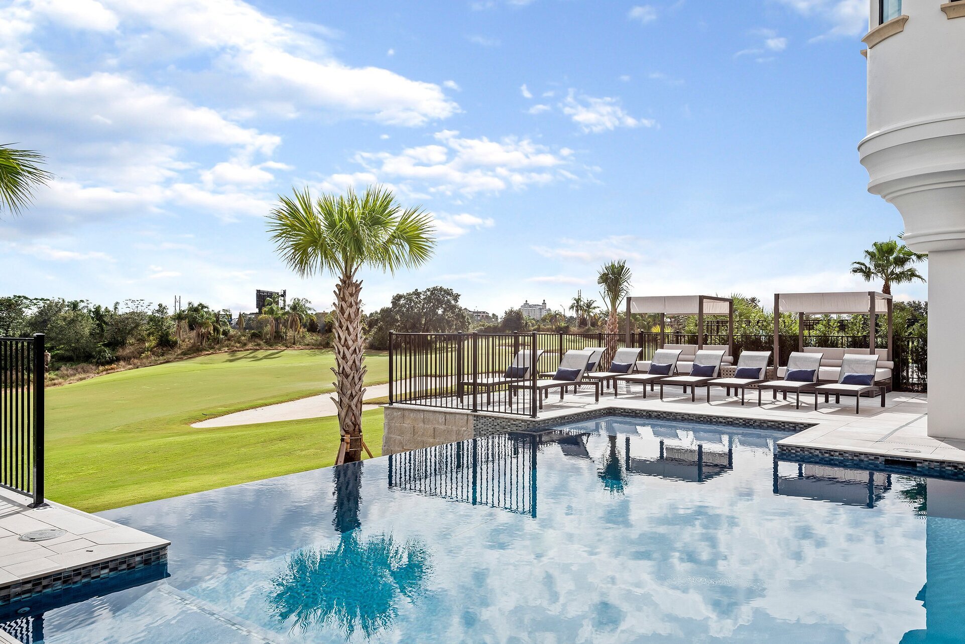 Spend your days lounging by this incredible custom built pool with an unbeatable view