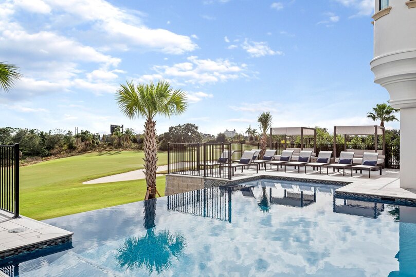 Spend your days lounging by this incredible custom built pool with an unbeatable view