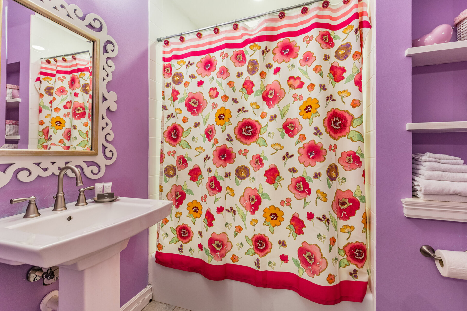 The en-suite bathroom has a tub/shower combination