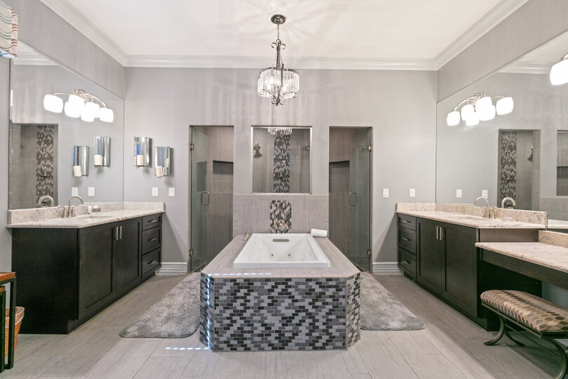 The master en-suite bathroom features a walk-in shower and jetted tub to relax