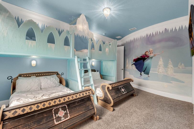 Head upstairs to this icy princess room complete with two full beds and two twin beds