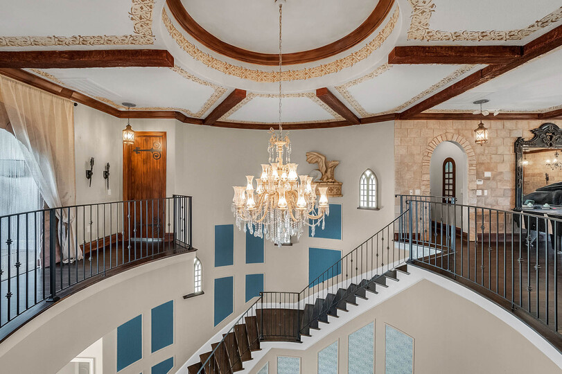 The upstairs loft area overlooks the foyer and also has access to a beautiful balcony