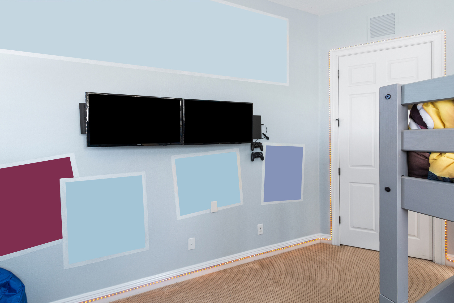Custom artwork and TVs connected to fun gaming systems