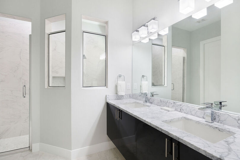 Beautiful bathroom countertops with a dual vanity and walk in shower