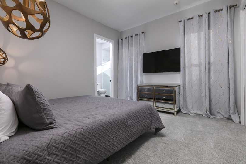 Lounge in this king-size bed and watch a movie