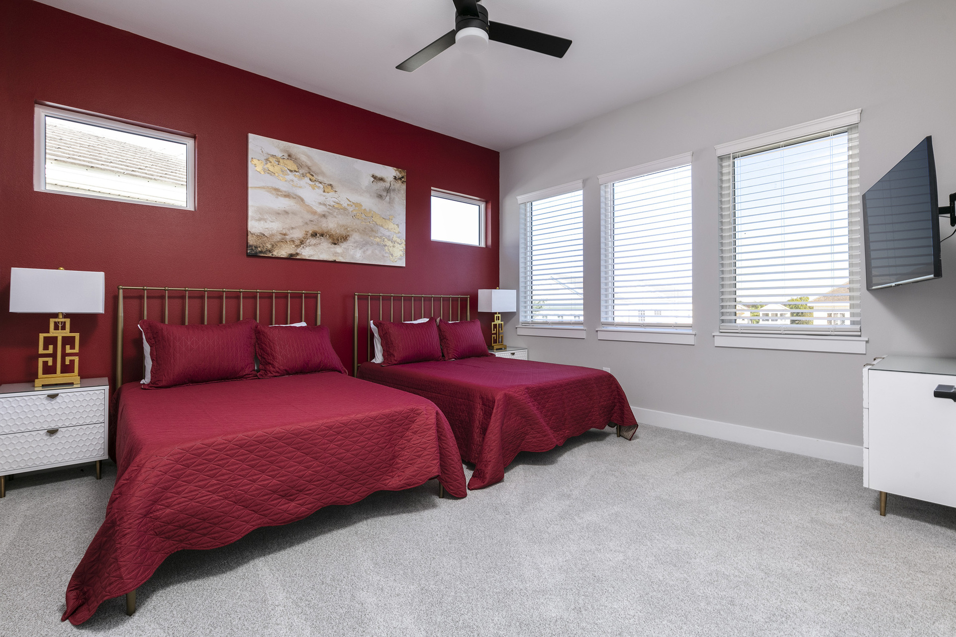 Sleep soundly in this bedroom with 2 full-size beds, plenty of natural lighting and a TV