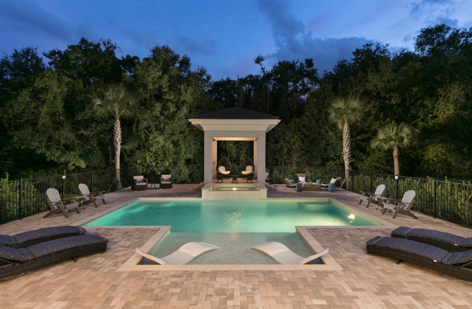 The exterior pool lighting create a wonderful atmosphere for a night-time swim