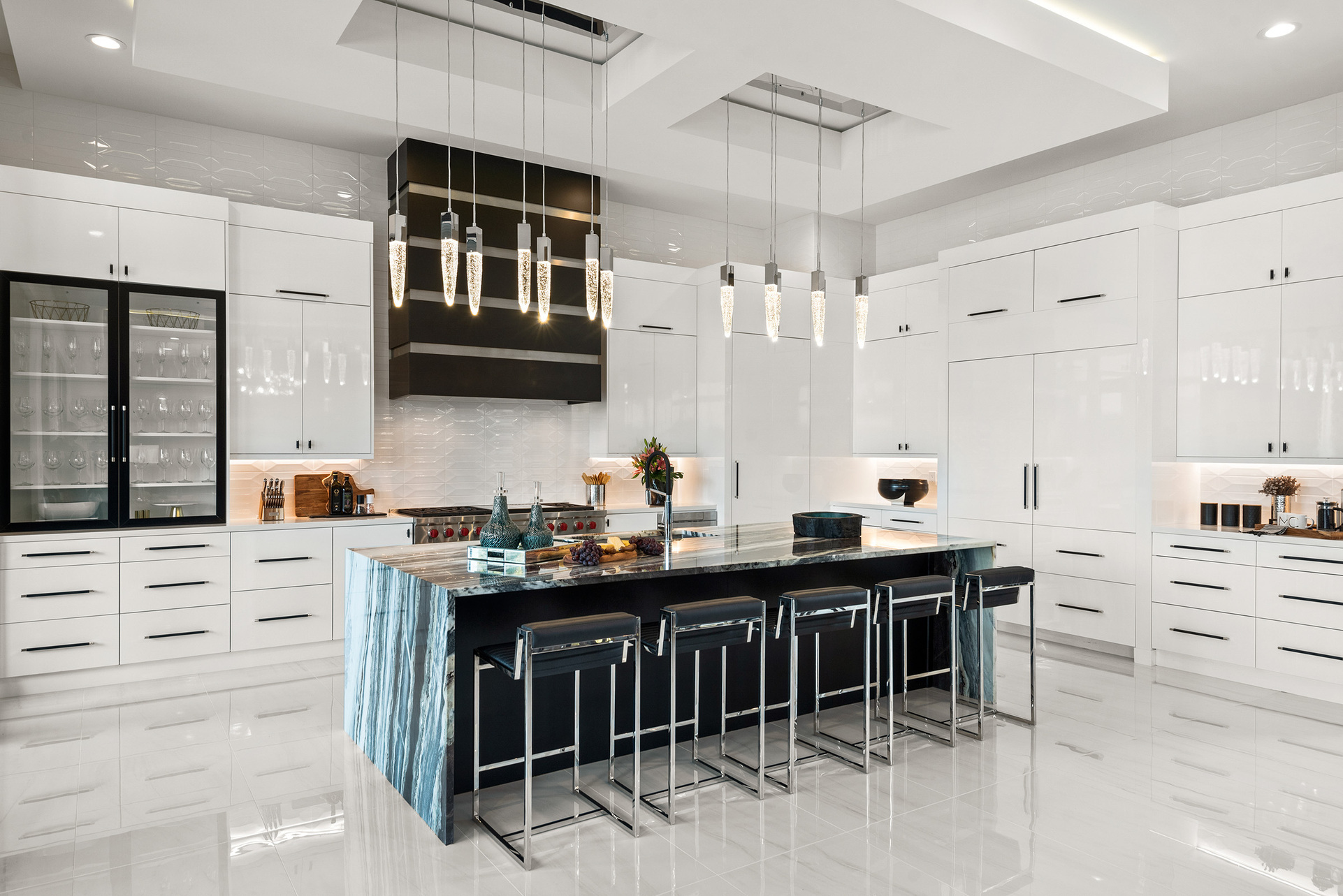 The kitchen features a 60-inch range(stovetop), microwave drawer, and a state-of-the-art refrigerators