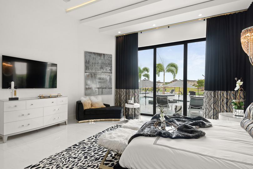 Enjoy a view of the pool from the ground floor Grand Master Suite