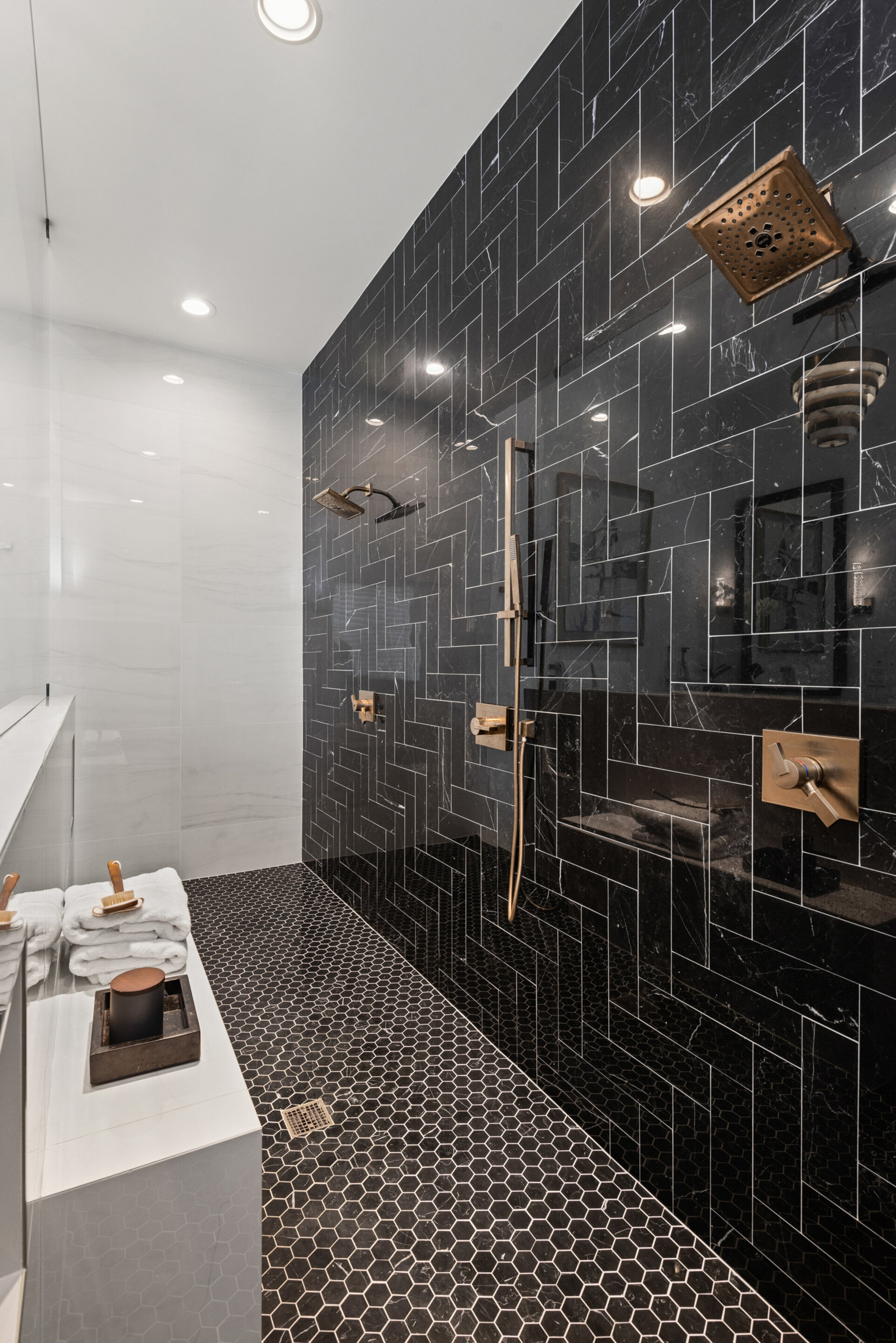 The ensuite bathroom has dual shower heads in the walk-in shower