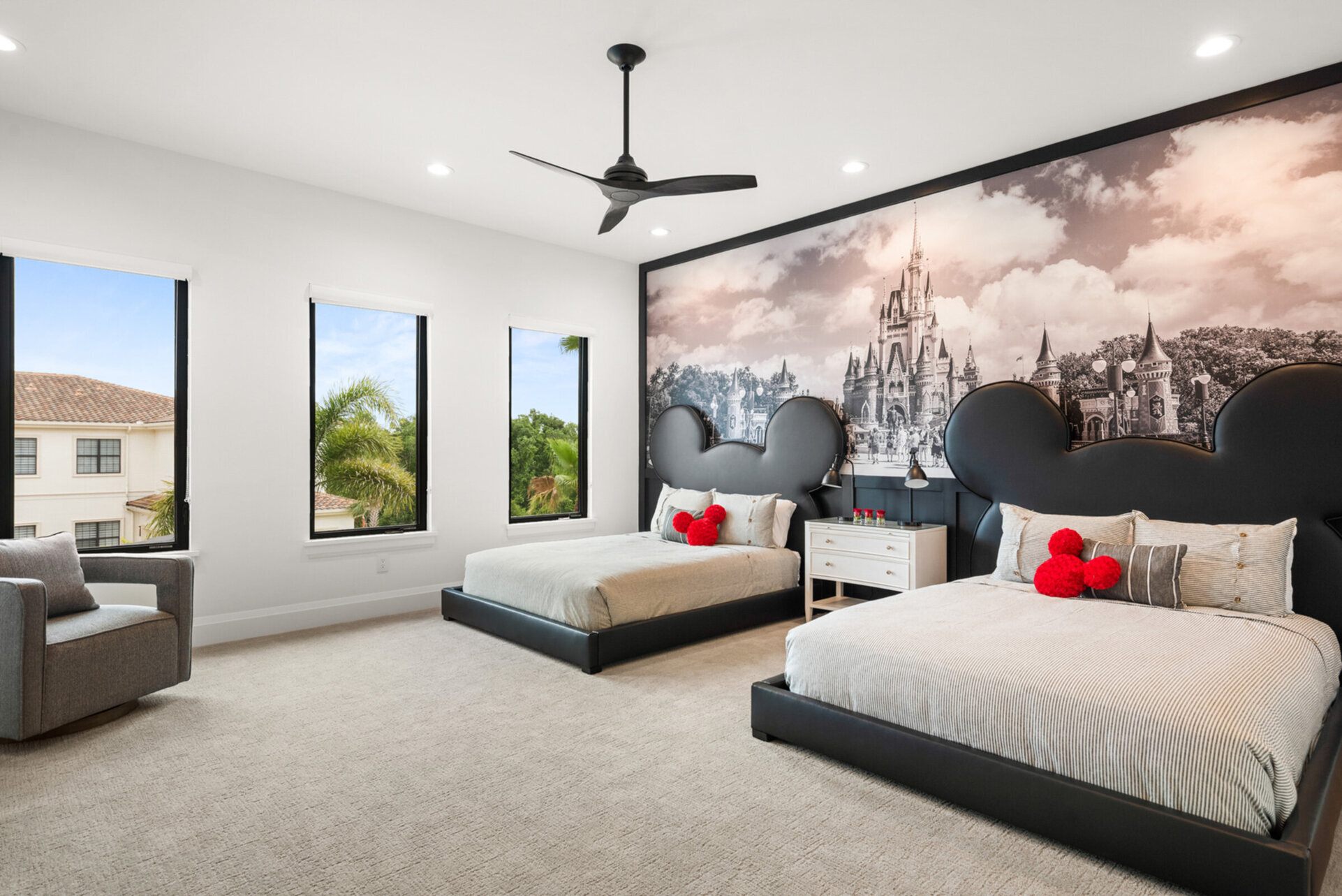 Two queen-size beds in an upstairs bedroom