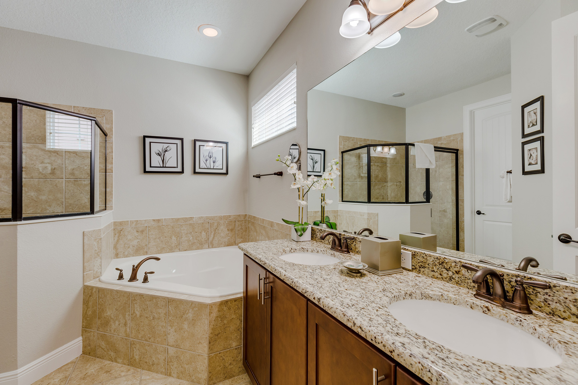 Get ready in the ensuite bath with a dual vanity, walk-in shower and garden tub