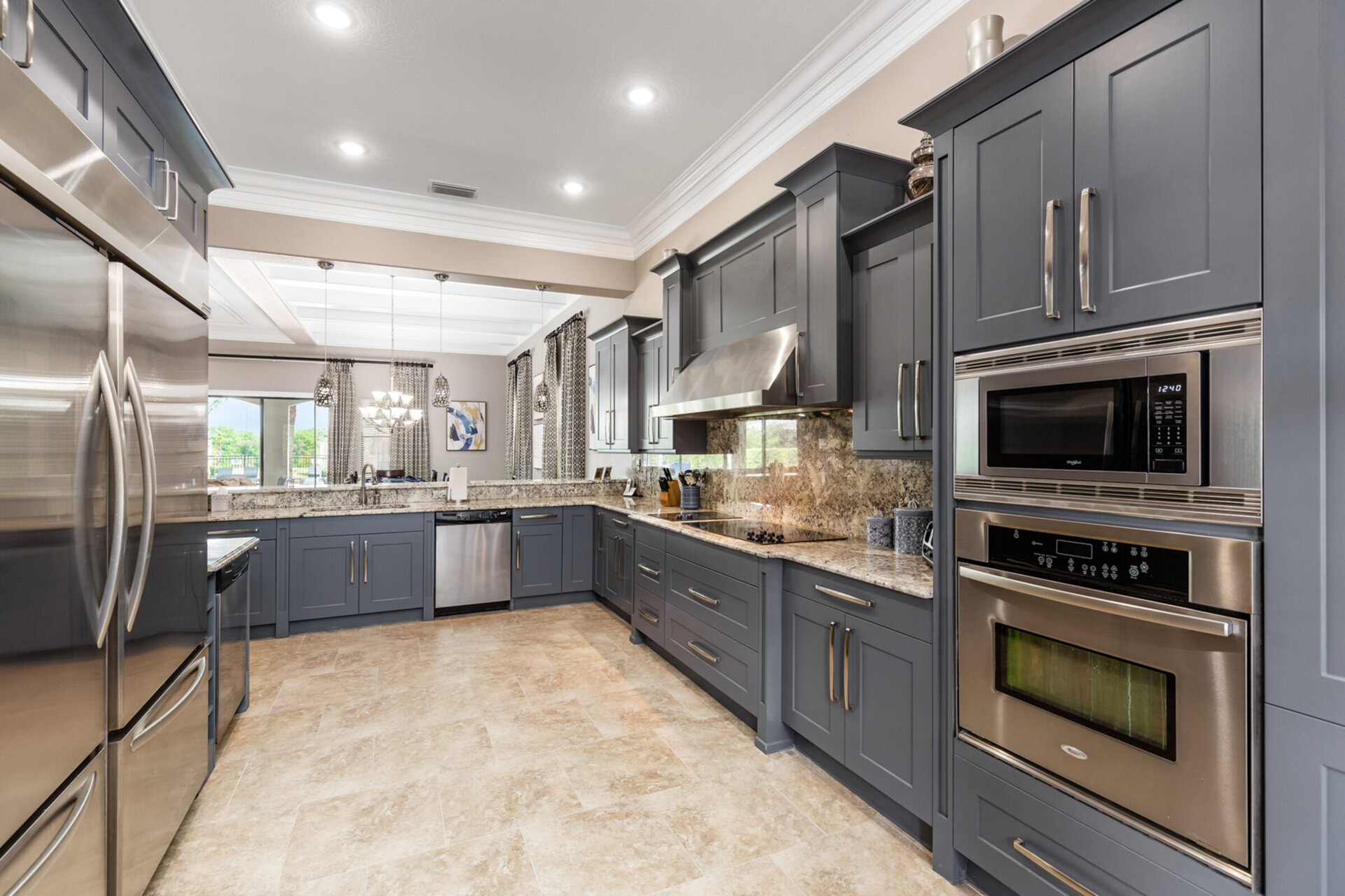 The kitchen is fully equipped and features stainless steel appliances