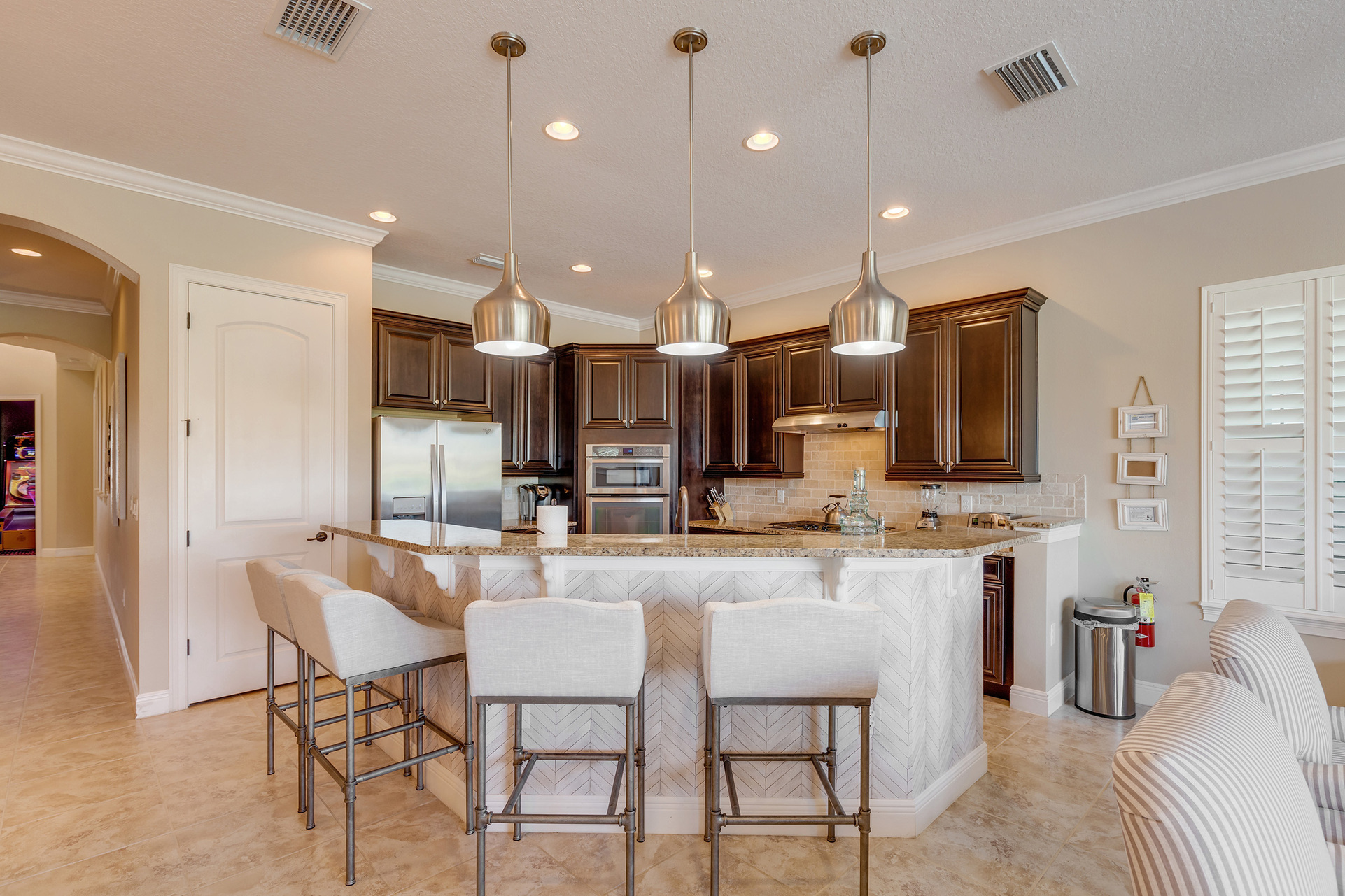 Beautiful fully equipped kitchen with barstool seating