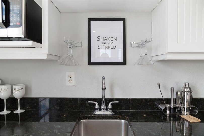 Wet bar with fridge for cocktails and also a microwave perfect for making popcorn