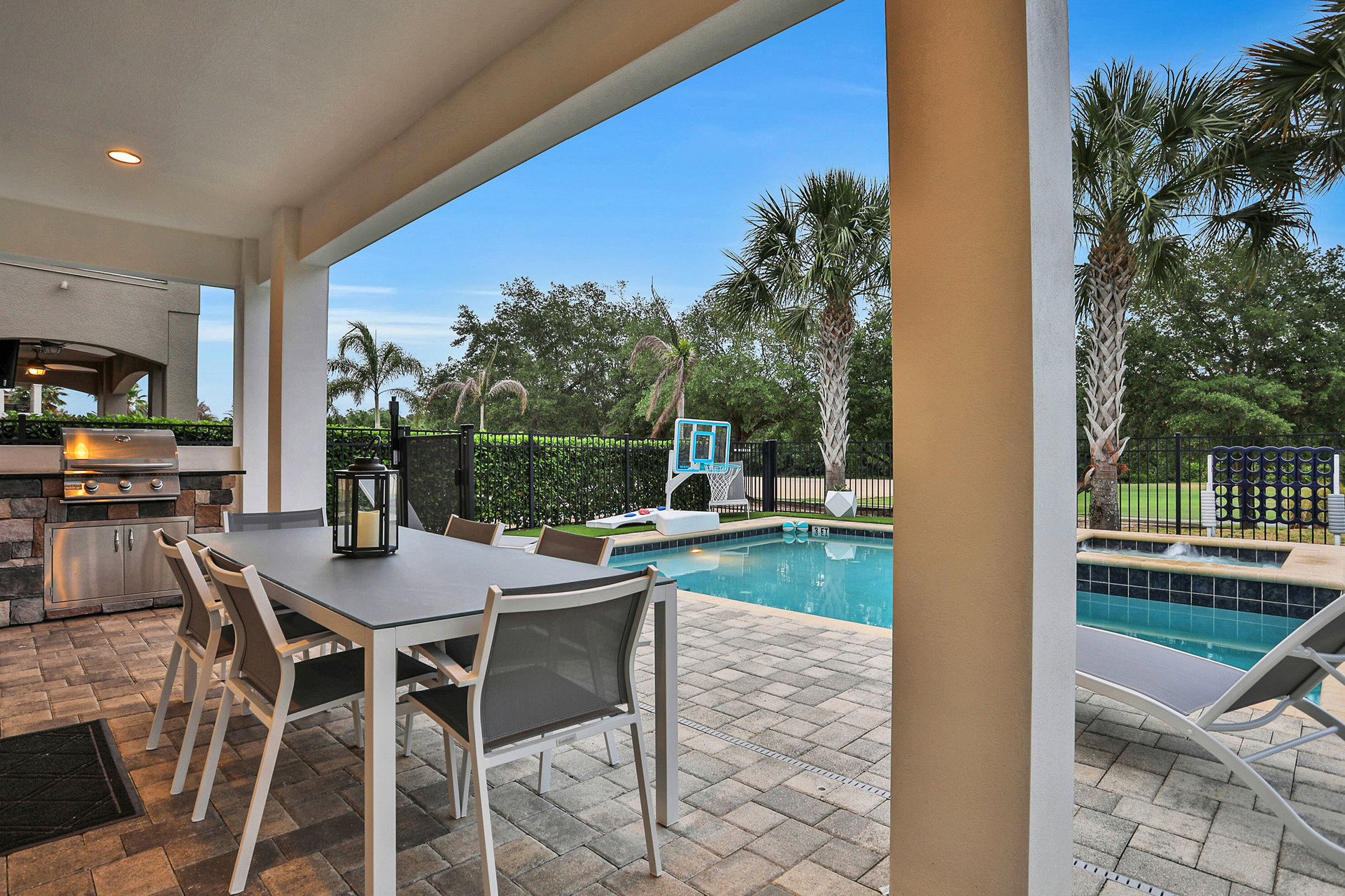 A summer kitchen to grill to perfection and outdoor dining with seating for 8