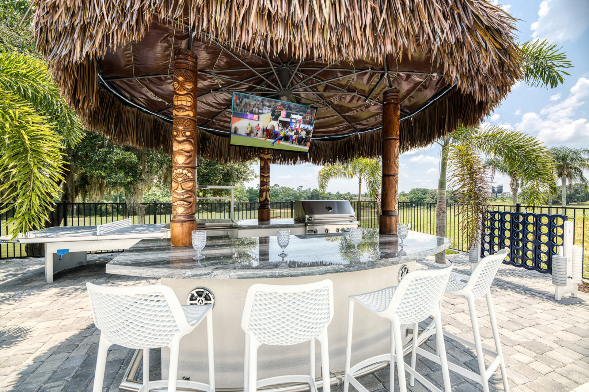 This fun feature elevates the tropical oasis experience with a wine cooler, a mini-fridge, and bar seating while enjoying your favorite show on the T.V