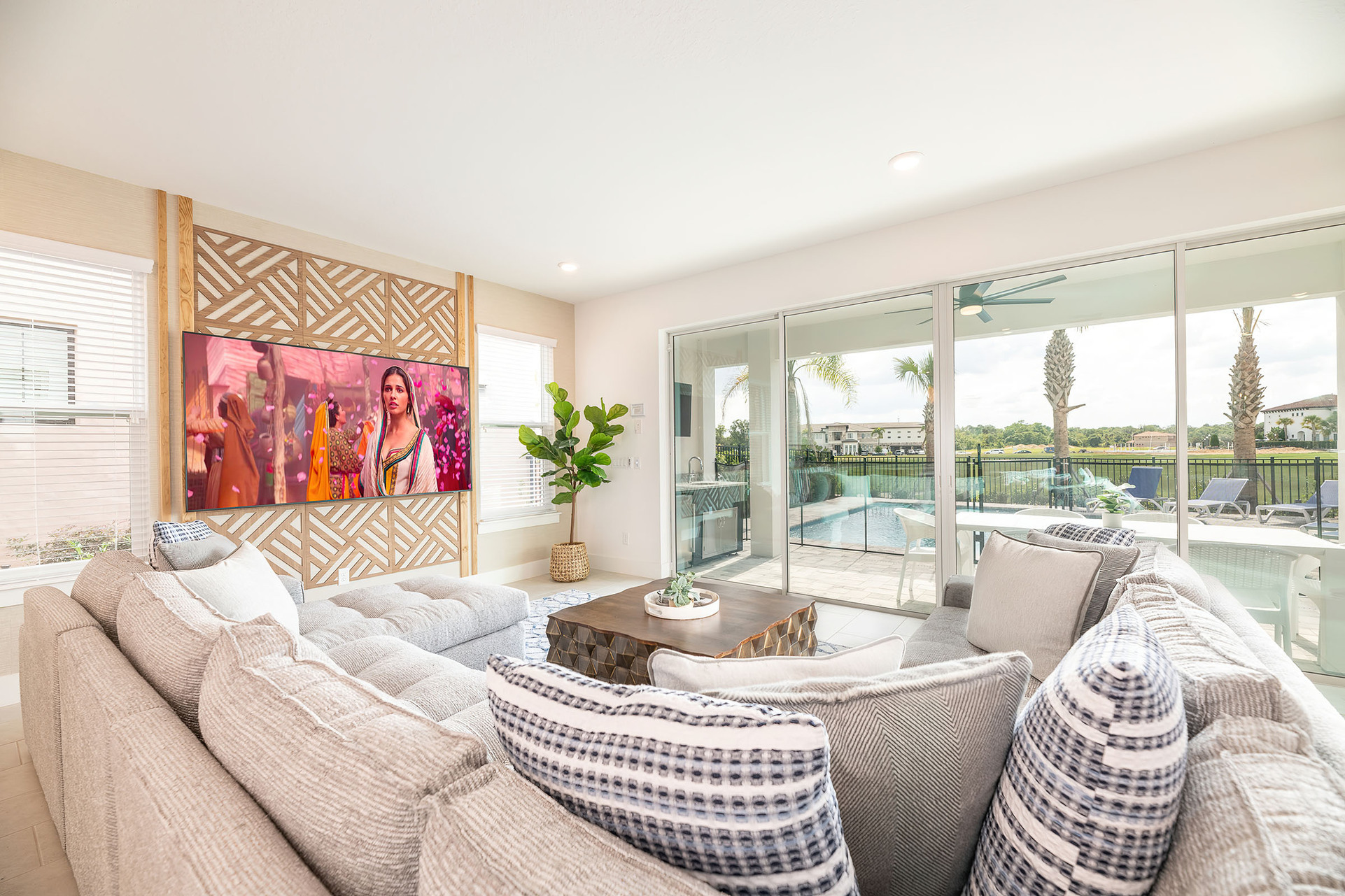 Gather the whole family together on the comfortable sectional sofa for a home movie on the 85-inch Smart TV